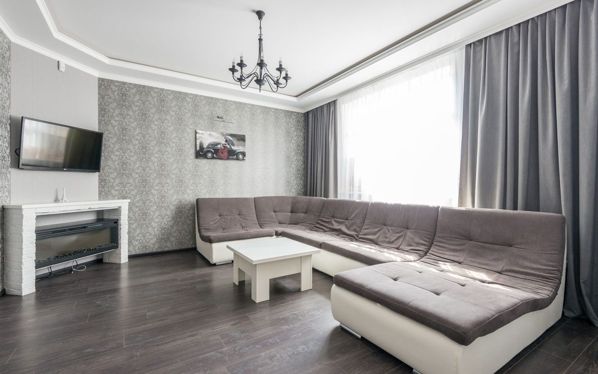 Wrap-around sectional sofa in a bright, spacious living room