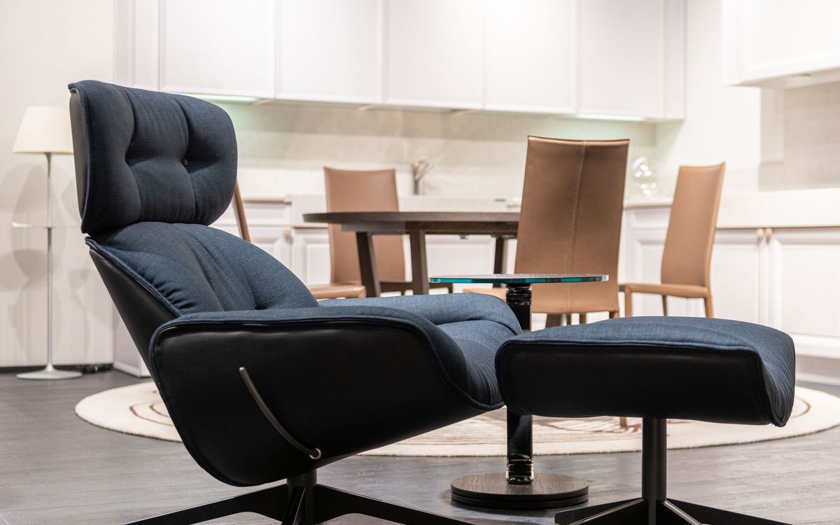 Armchair beside a table in a bright, modern room