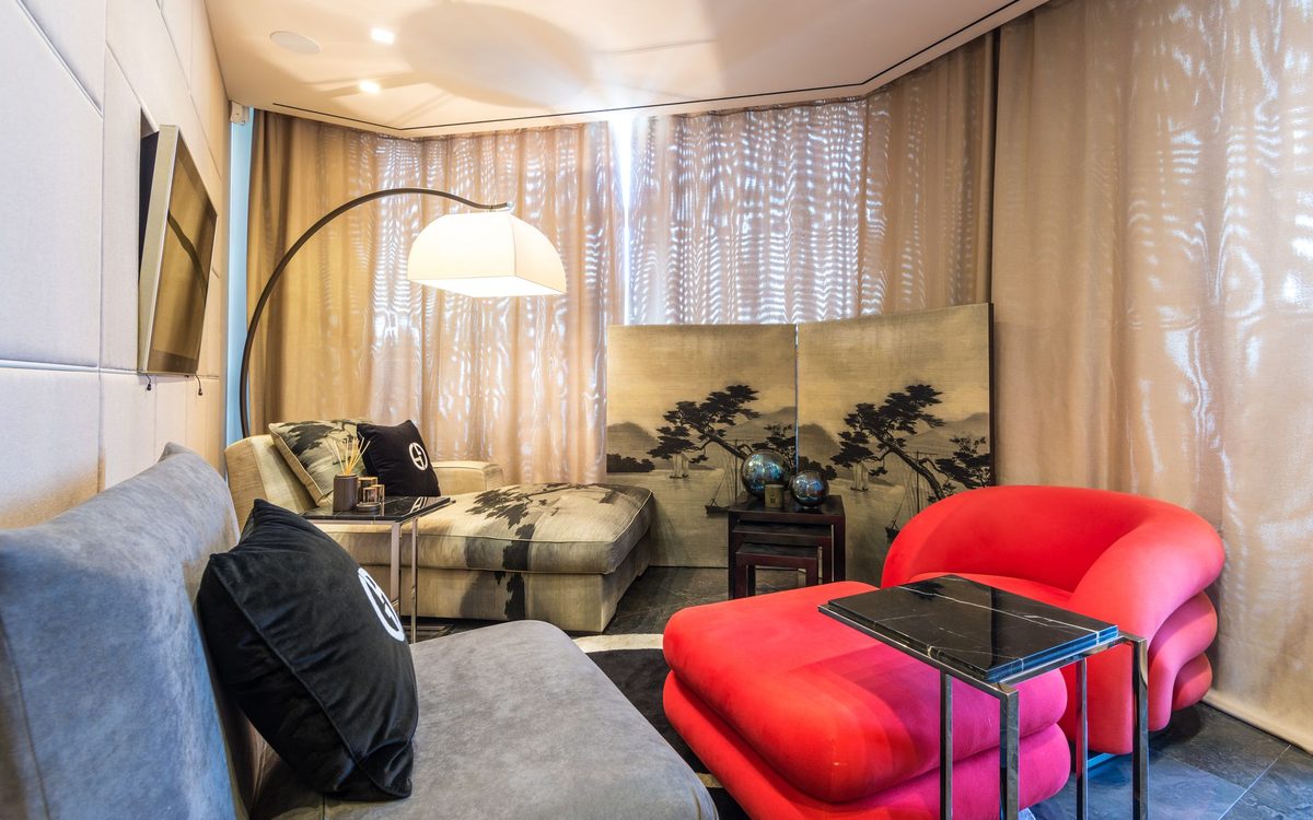 Living room with upholstered armchairs and soft lighting
